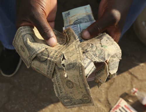 On Zimbabwe’s streets torn and soiled USD notes are worth half their face value