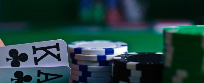 white and black dice on green table